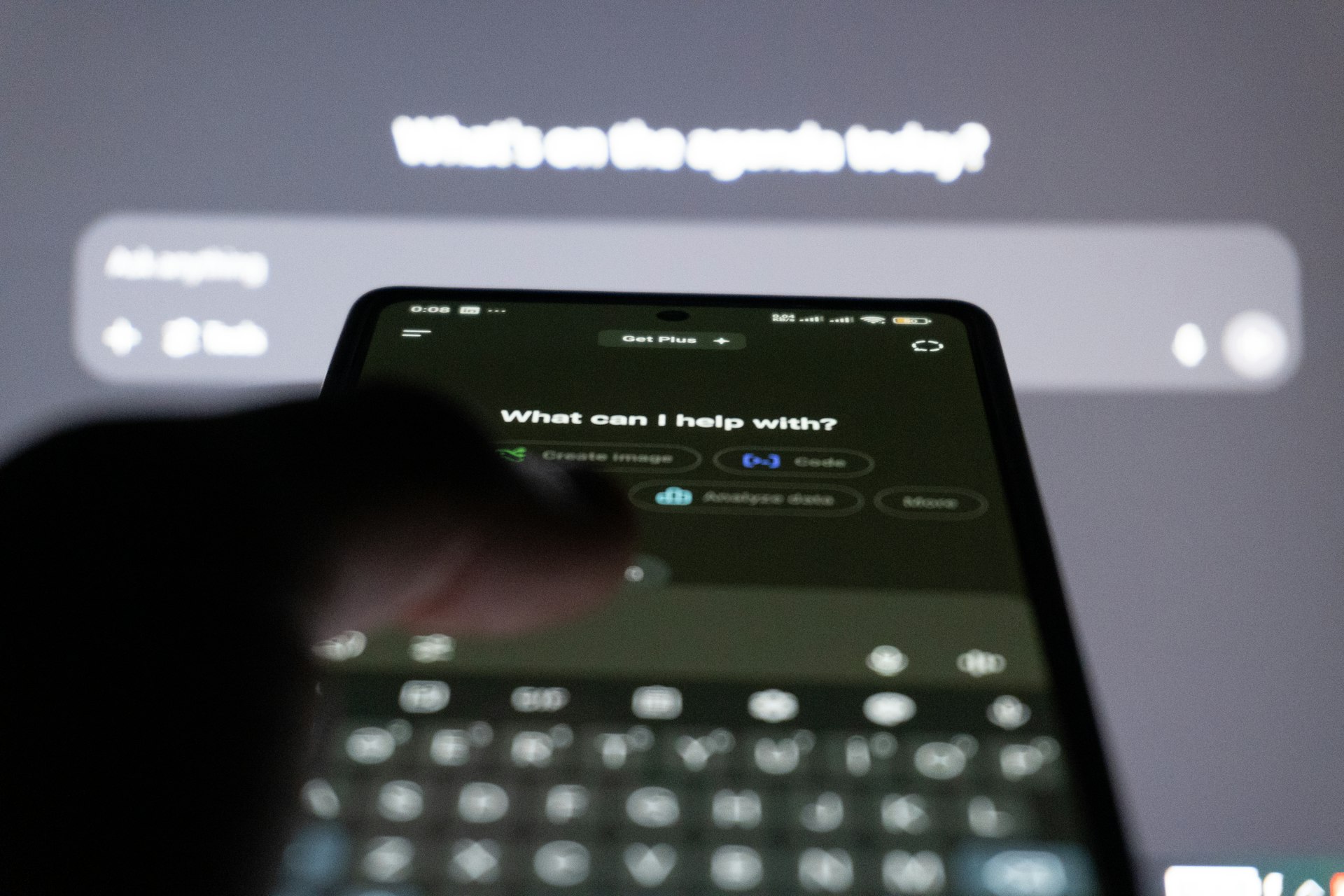 Person typing on smartphone with ai chatbot on screen.